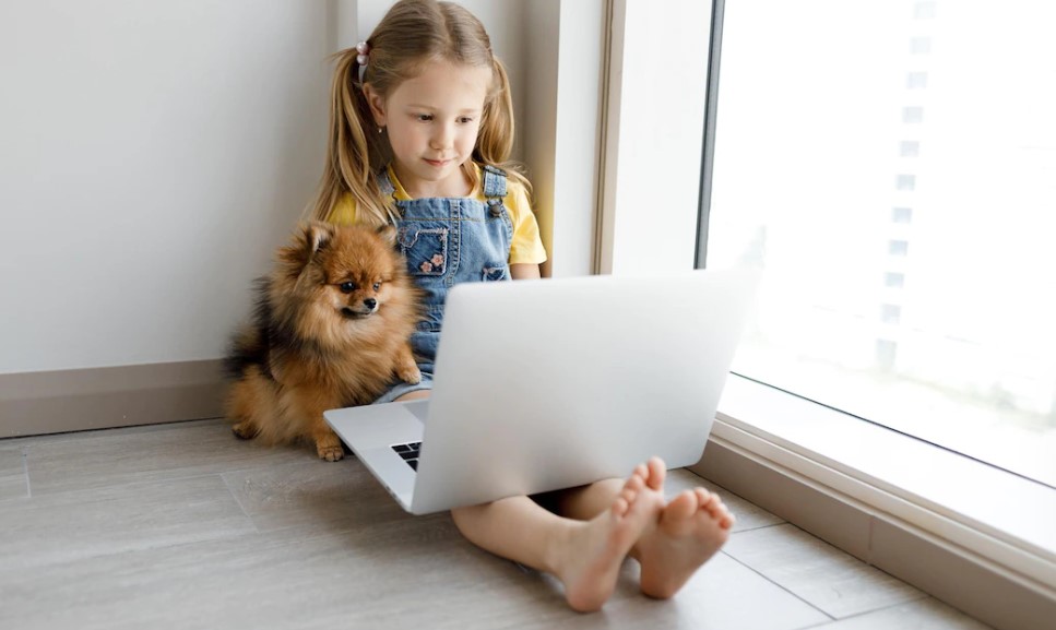 little girl with a laptop